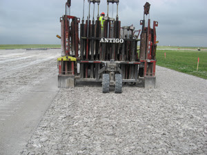 A rubblizer grinds up the old pavement to be re-used.